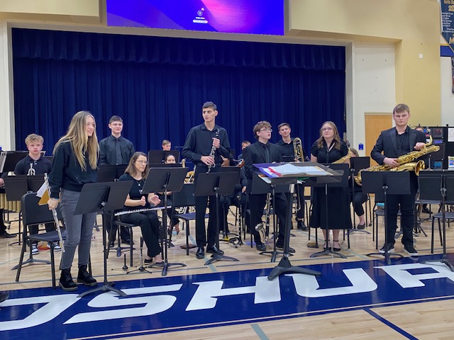 Band gets ready to perform at their concert.