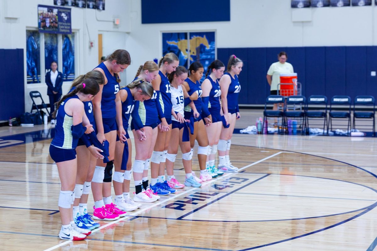 Mustangs during prayer