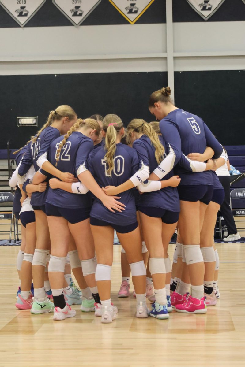 The team prays before the game