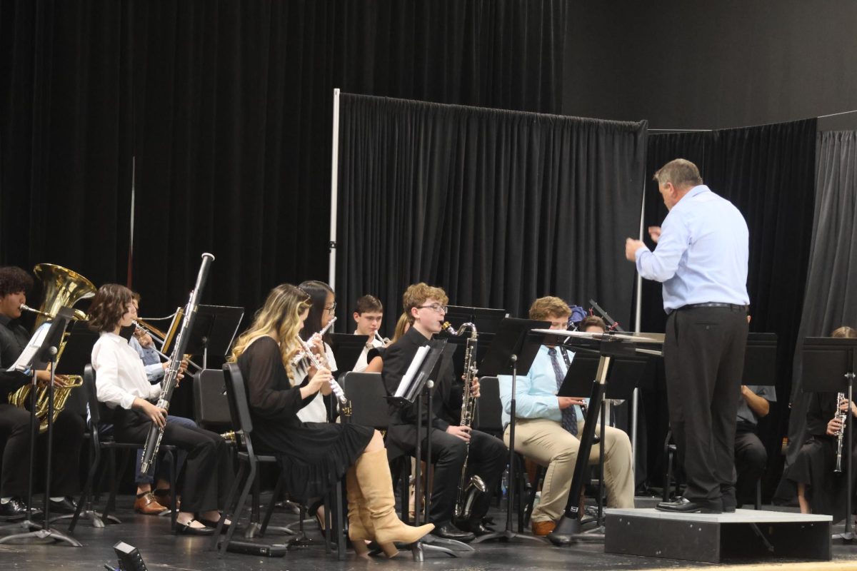 Middle and upper school band plays for the crowd. 