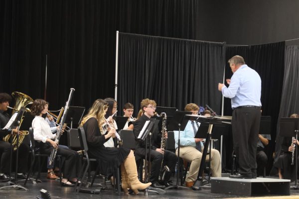 Middle and upper school band plays for the crowd. 
