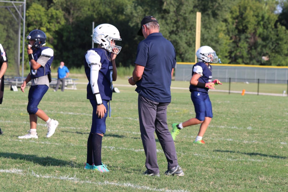 Coach Brence Encourages his Players