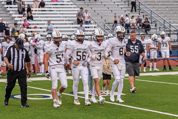 The team captains walk out together