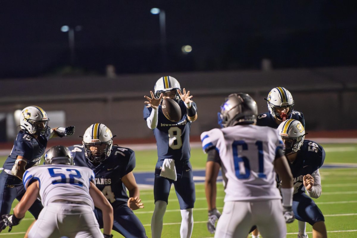 Cody Dow takes the snap. 