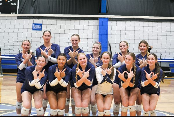 the Lady Mustangs group photo celebrating their win