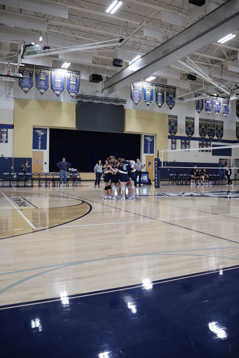 The Mustangs huddle together
