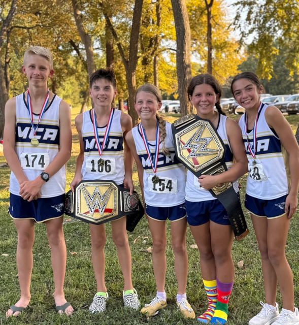 Medalists and Ric Flair Award winners huddle together after their races.
