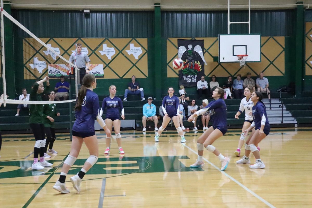 Freshman, Kate Thomas, passes the ball. 