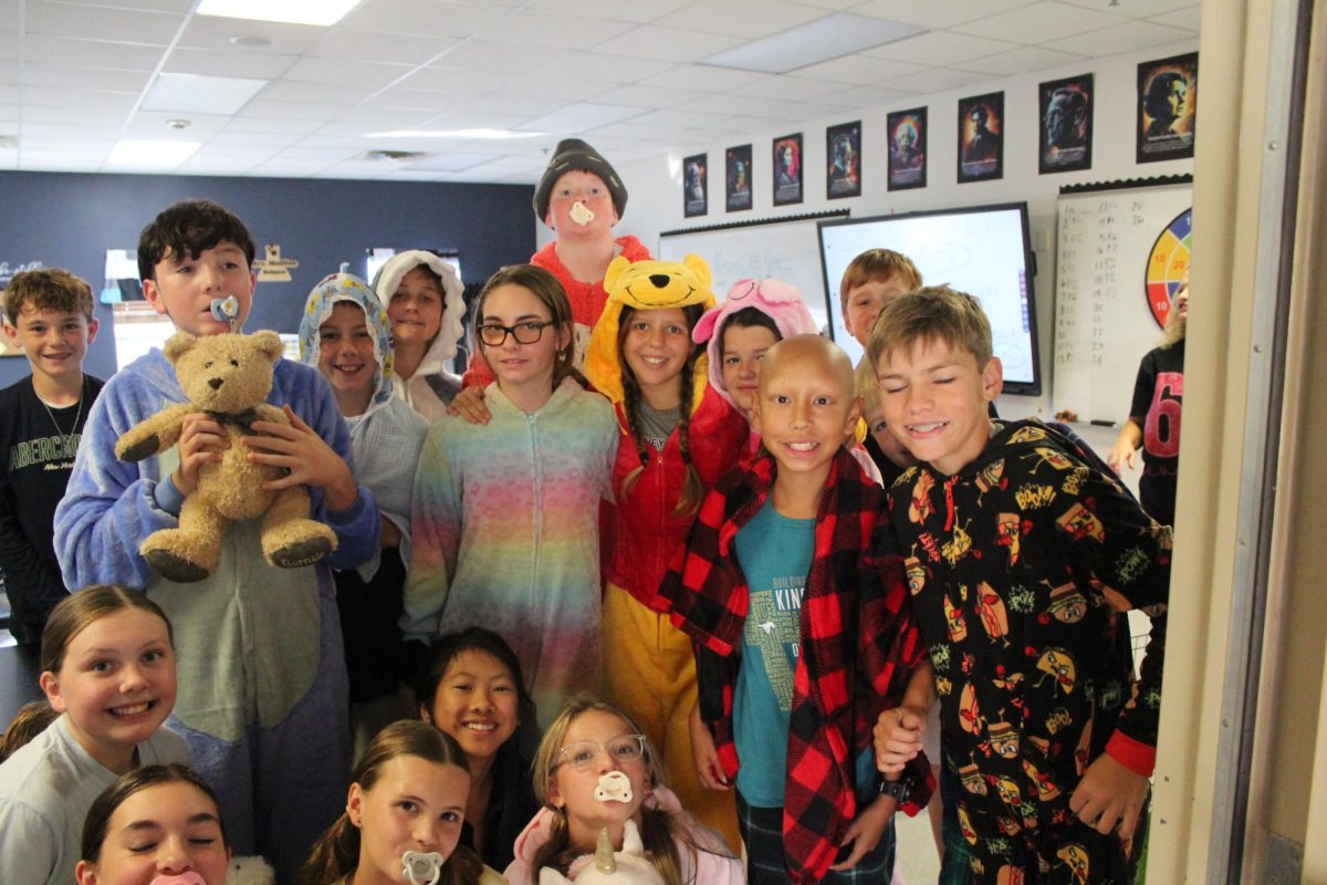 Sixth grade students pose for a picture on Tuesday for dress your grade day. 