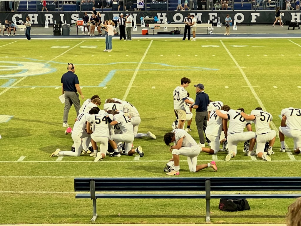 Team takes a knee.