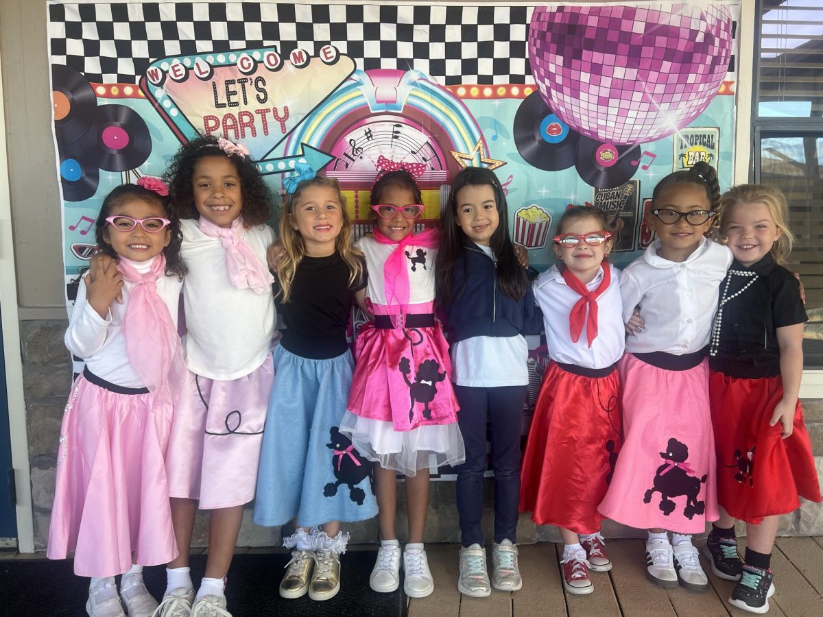 Kinder girls pose for picture