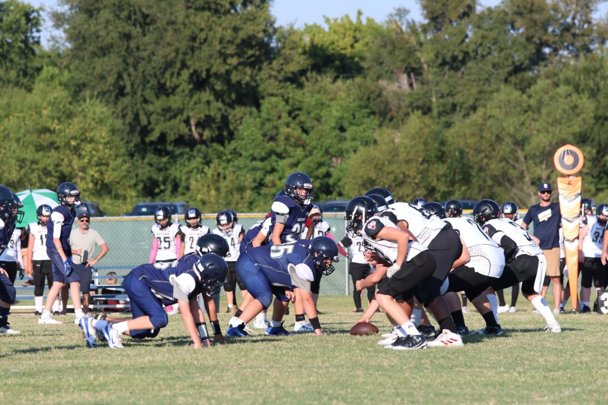 Mustangs Line up for the snap.