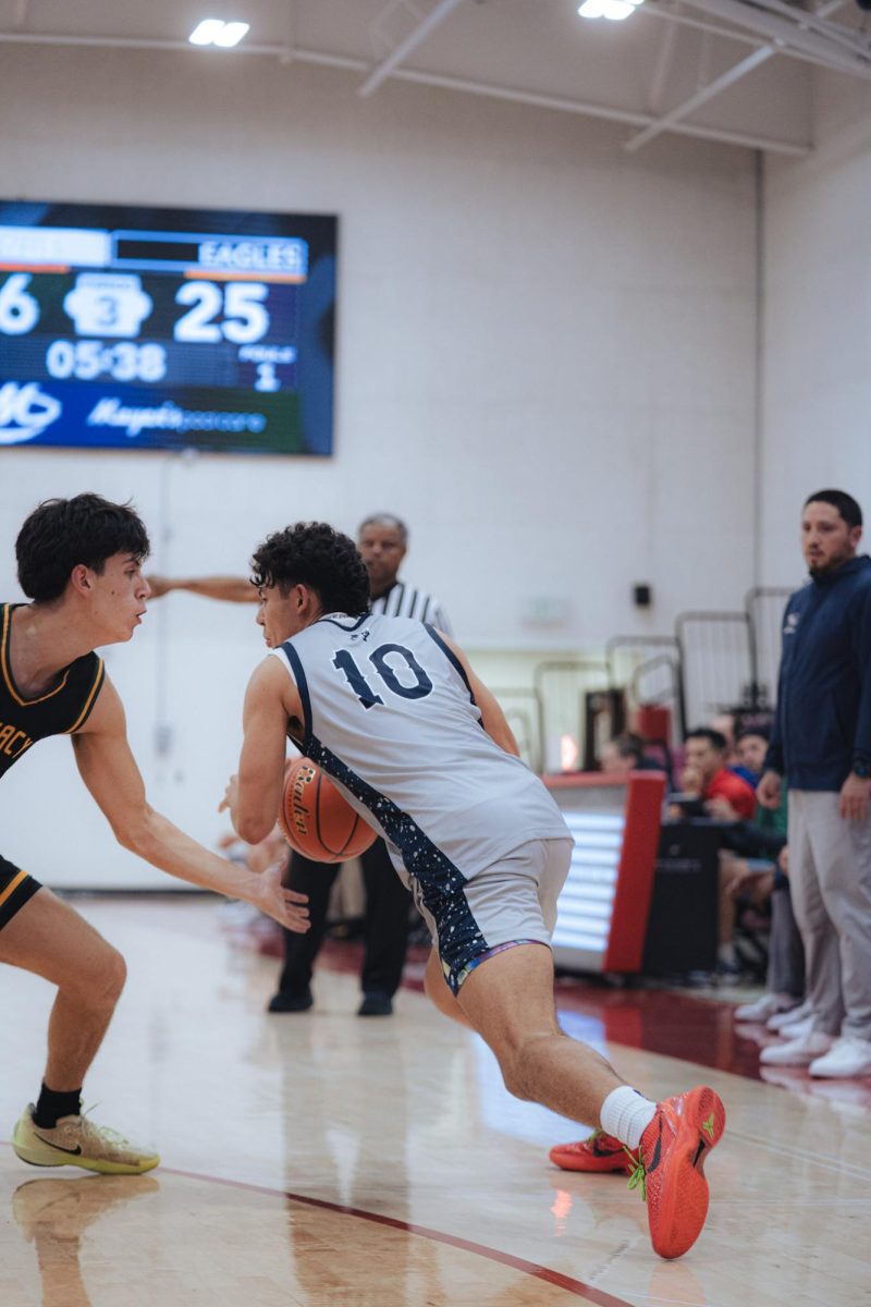 Junior, Diego Landin drives to the hoop.