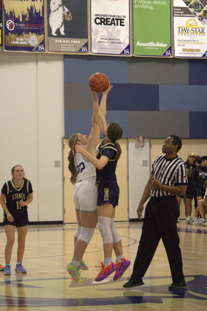 Sophomore, Elizabeth Thompson, gets the jump ball.