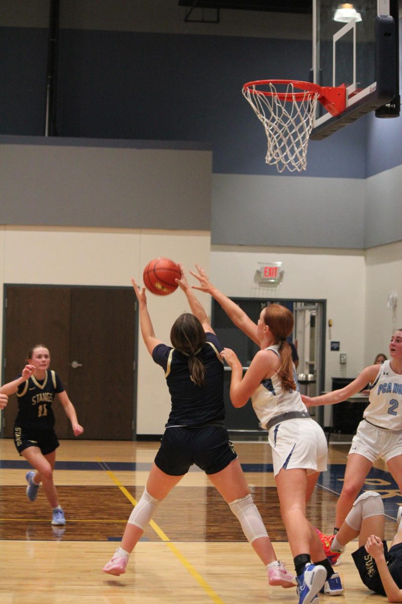 Junior, Kamryn Firth, gets the rebound