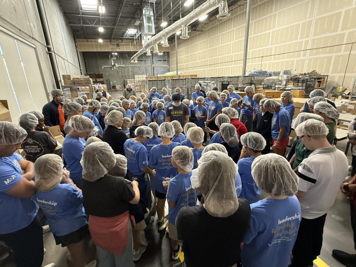 Big Dogs pray before serving food.
