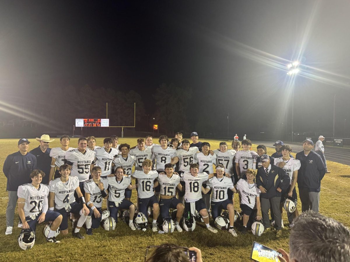 Mustangs taking a picture after the game