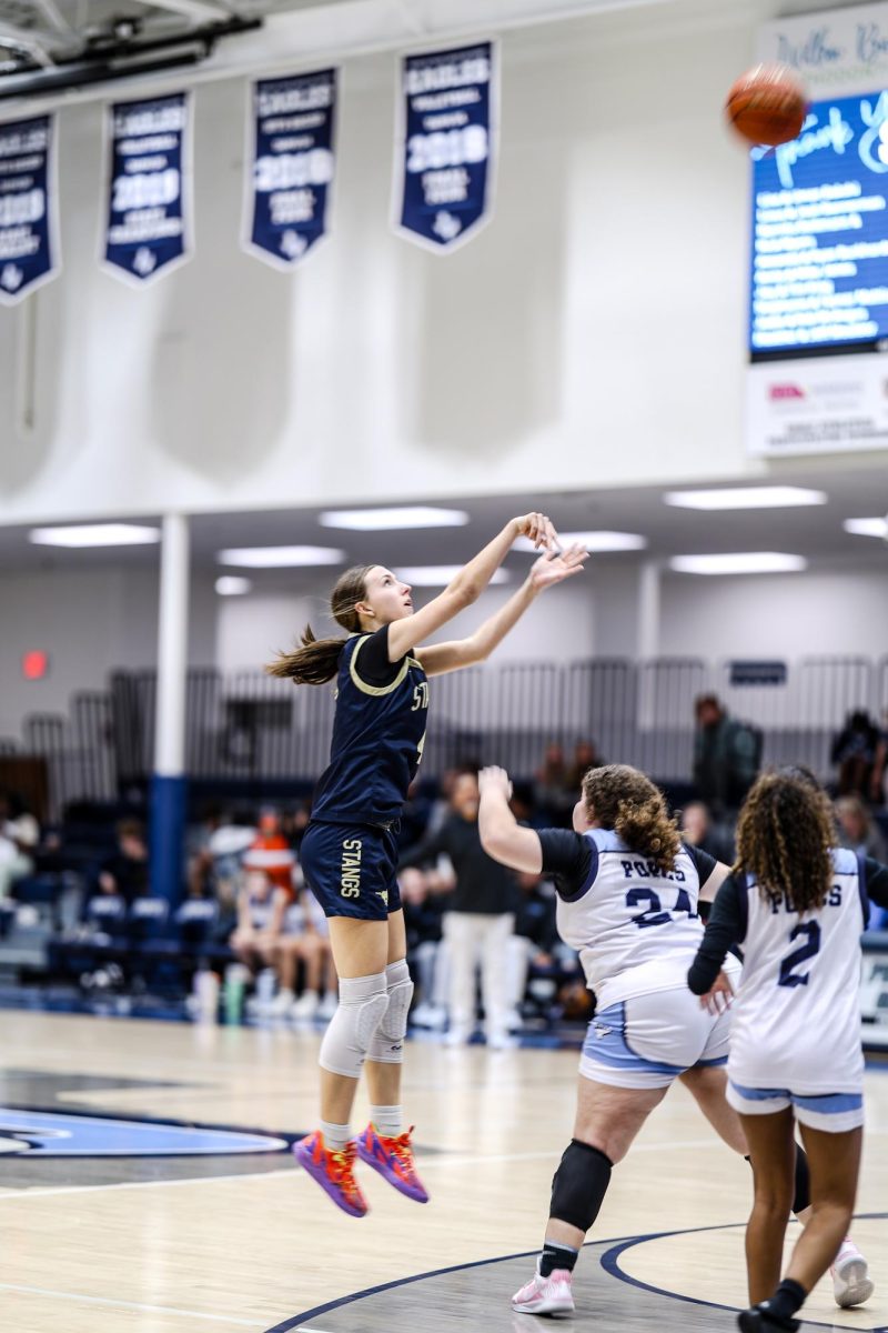 Sophomore, Elizabeth Thompson, shoots a three