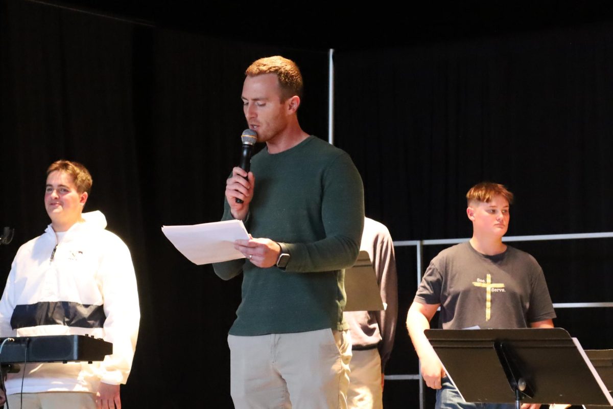 Warren Truesdale makes his introduction to the Christmas chapel.