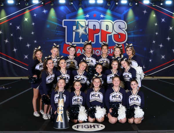 MCA cheerleaders smile after competing.