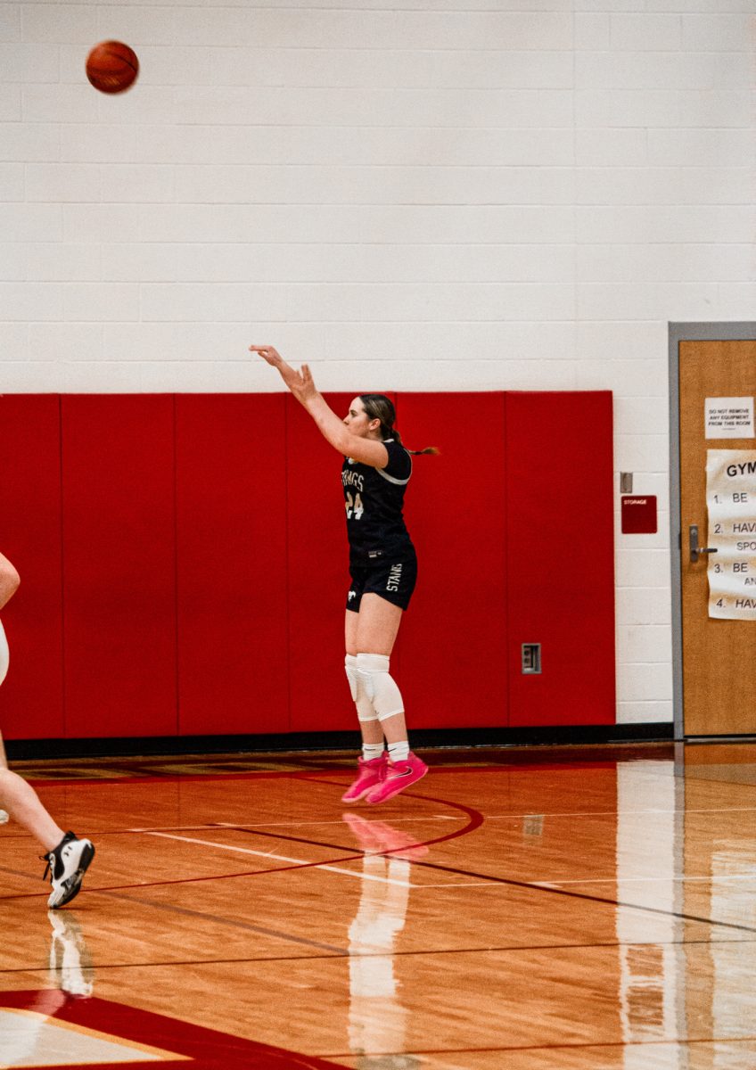 Sophomore Harper Johnson shoots the ball.