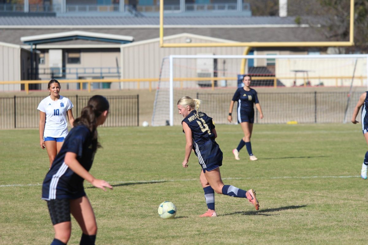 Senior Tatum Barnard Dribbles the ball