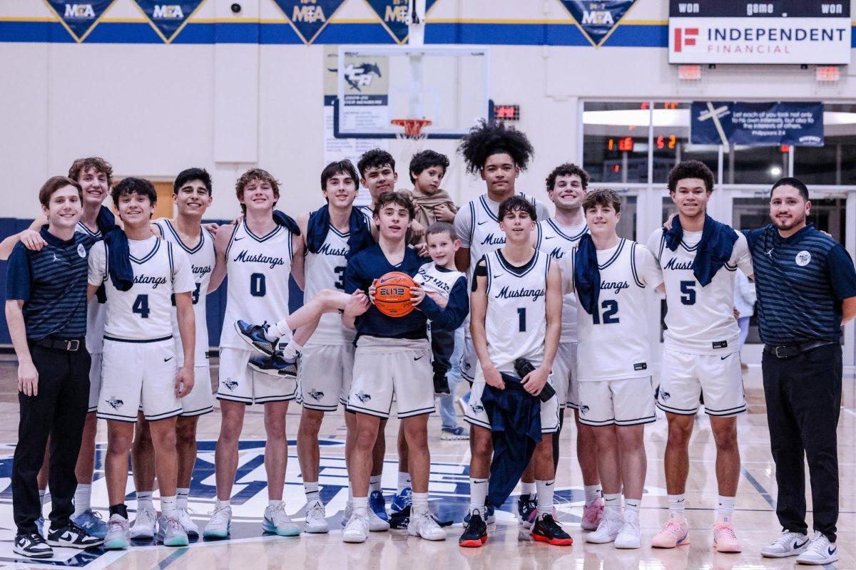 The Mustangs take a celabratory photo after the big win!