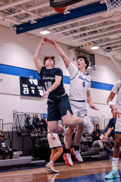 Junior, Jude Bleecker, makes the layup for the and-1