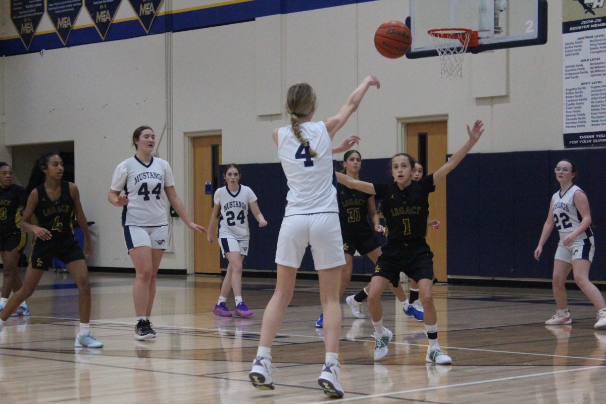 Eighth Grader Taylor Vineyard passes the ball to her teammate.