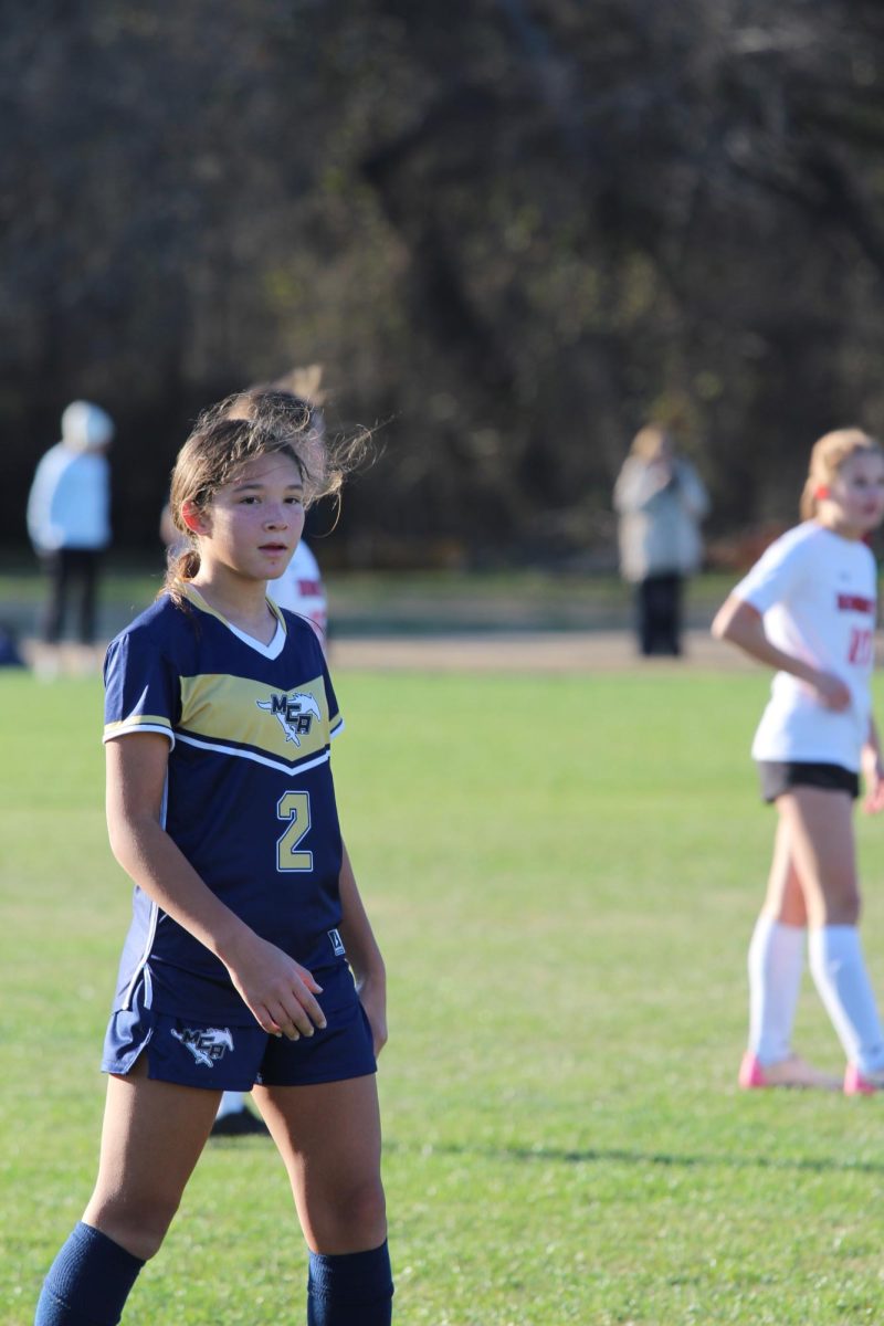 Seventh grader, Mikaela Hunt, walks down the field. 