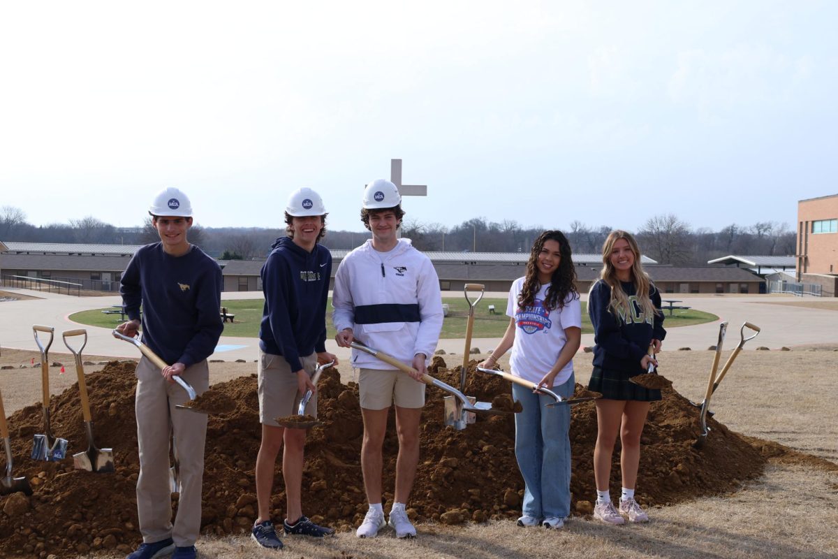 Seniors Alyssa Prahl, Cody Dow, Jaxon Dover-Smith, and Bradley Giroux group together for a picture.