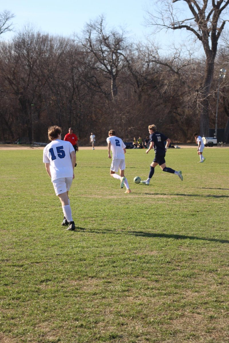 Senior Hutson Clayton dribbles the ball.