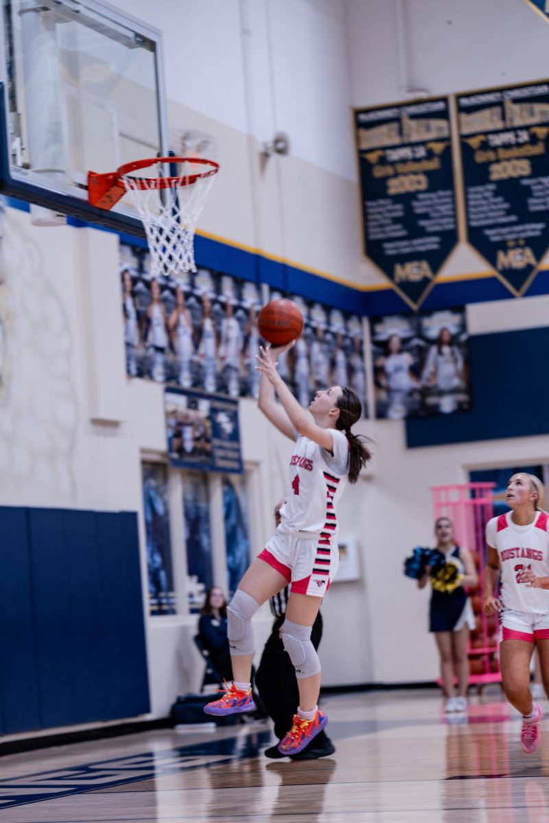 Elizabeth makes a layup. 