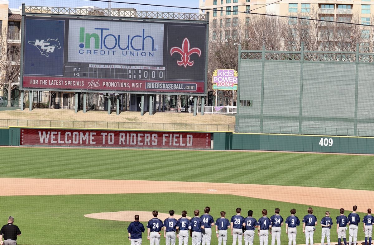The team lines up for the National Anthem.