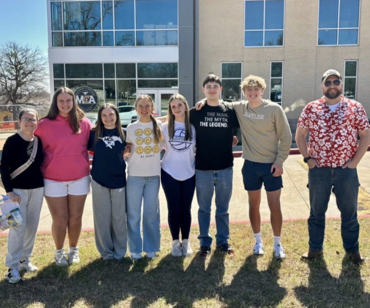 Students prepare to travel to Arkansas.