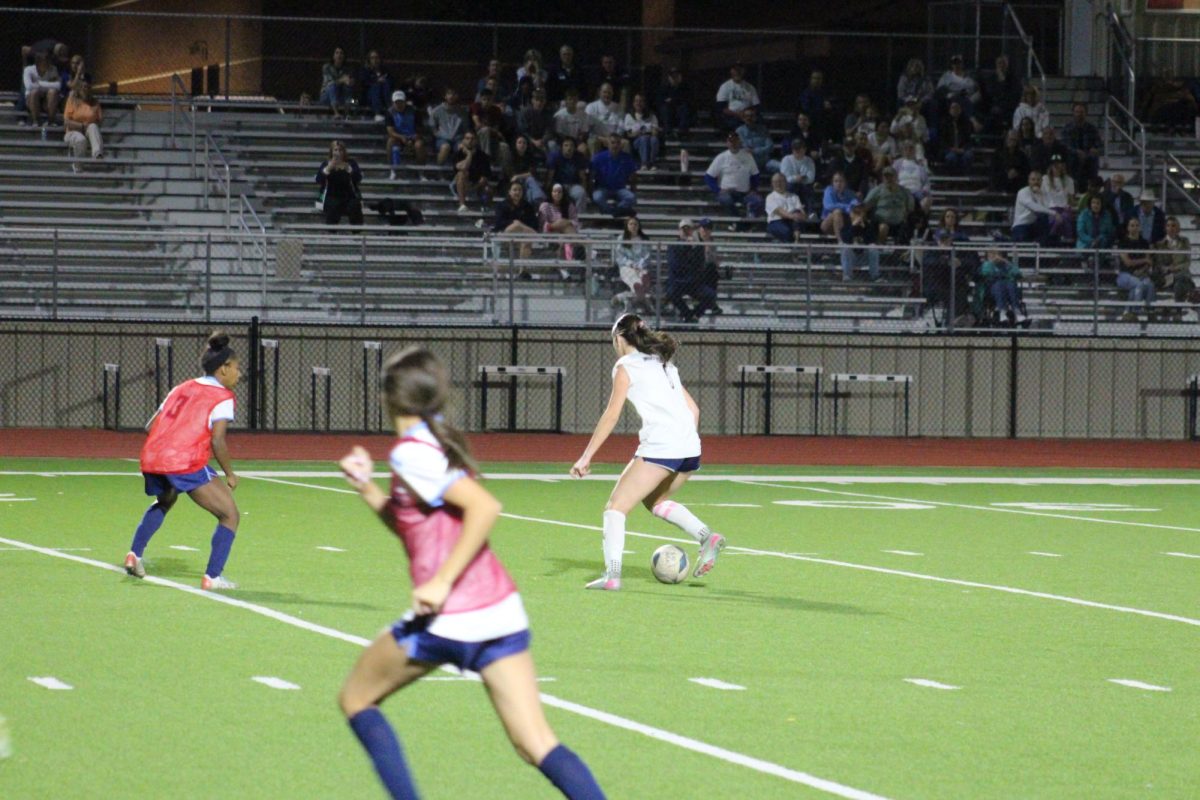 Senior Sadie Zbranek dribbles ball down the field.