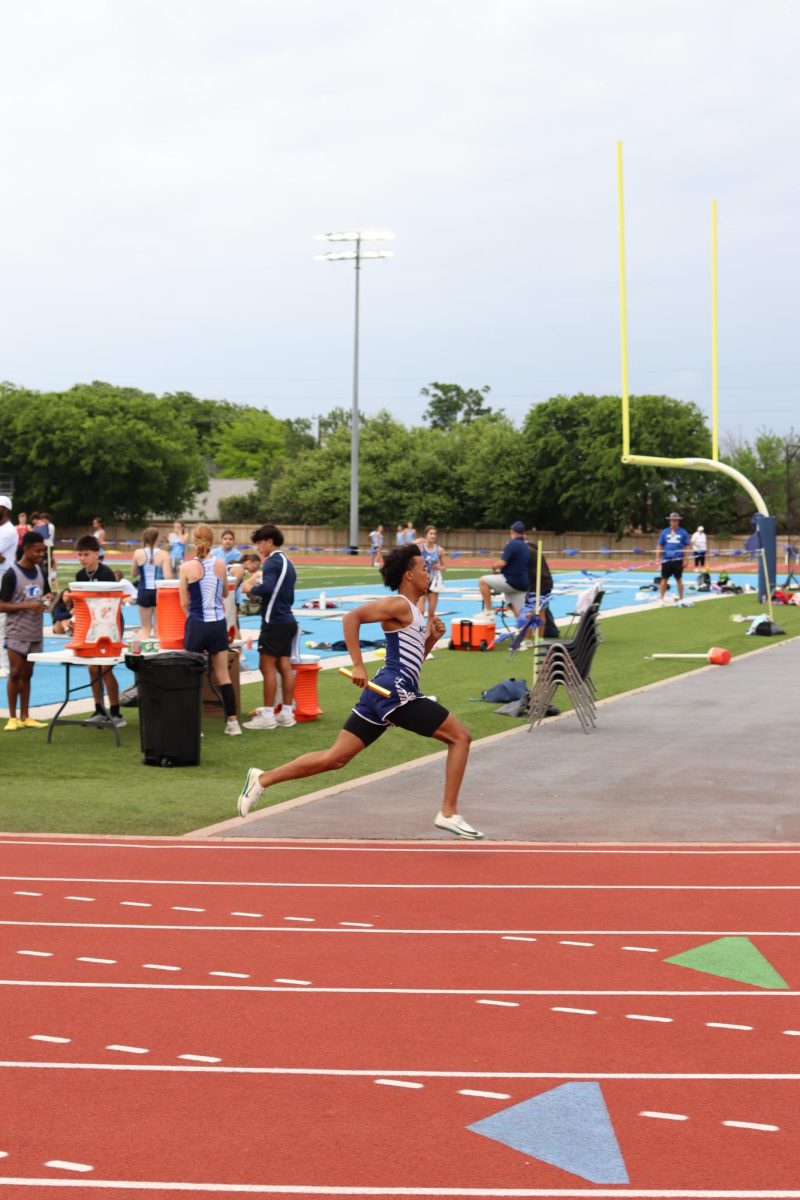 Senior Adam Gicheru runs at top speed.