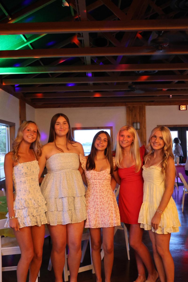 Seventh Grade girls come together for a photo. 